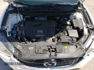 2014 Mazda CX-5 Touring z VIN JM3KE4CYXE0393443, wystawiony jako Copart lot #54738705 z przebiegiem 68 220 mil mil oraz Szkody całkowita. Historia ofert i sprzedaży dostępna na DreamBid. Obrazek 12.