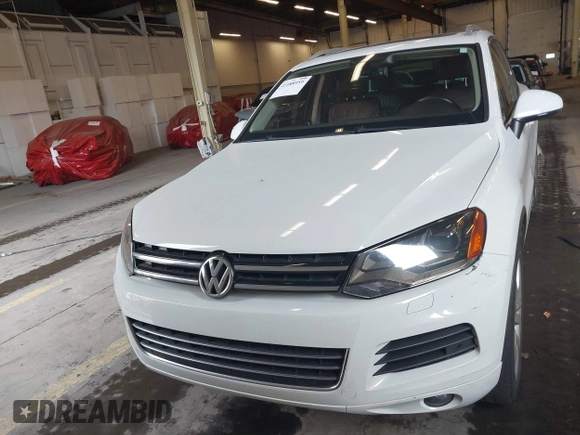 2013 Volkswagen Touareg Lux with VIN WVGEF9BP6DD007323, listed as a IAAI auction lot 41488959 with 123,383 mi miles and . Bid and sale history available at DreamBid. Image 13.
