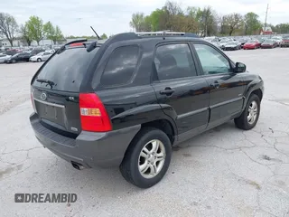 2007 Kia Sportage LX with VIN KNDJE723077397667, listed as a IAAI auction lot 42011122 with 218,744 mi miles and . Bid and sale history available at carsss.com. Image 4.