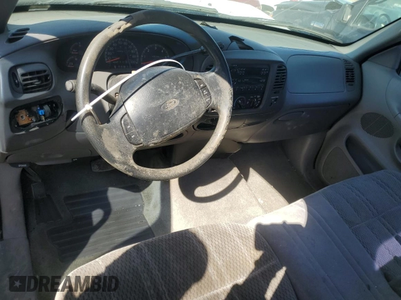 1997 Ford F-150 с VIN 1FTDF18W8VKC62309, выставлен на аукционе Copart как лот 48137745 с пробегом 156 917 миль миль и Списание • Salvage title. История ставок и продаж доступна на DreamBid. Изображение 8.