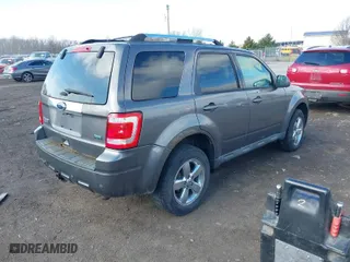 2011 Ford Escape Limited with VIN 1FMCU9EG2BKC59457, listed as a IAAI auction lot 41802716 with 195,734 mi miles. Bid and sale history available at carsss.com. Image 4.