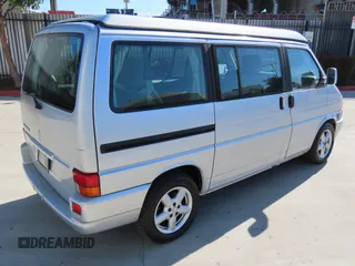 2003 Volkswagen EuroVan MV with VIN WV2NB47003H003033, listed as a Copart auction lot 47059195 with 164,173 mi miles and Clean Title. Bid and sale history available at DreamBid. Image 3.