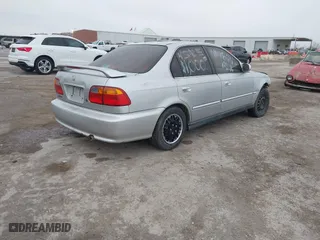 1999 Honda Civic EX with VIN 1HGEJ8649XL023282, listed as a IAAI auction lot 41496406 with 229,003 mi miles. Bid and sale history available at carsss.com. Image 4.