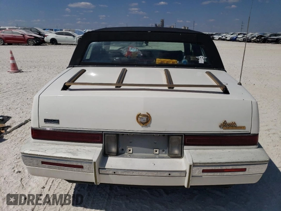 1991 Cadillac Seville z VIN 1G6KS53B9MU824142, wystawiony jako Copart lot #74276264 z przebiegiem 103 517 mil mil oraz Szkody całkowita. Historia ofert i sprzedaży dostępna na DreamBid. Obrazek 6.