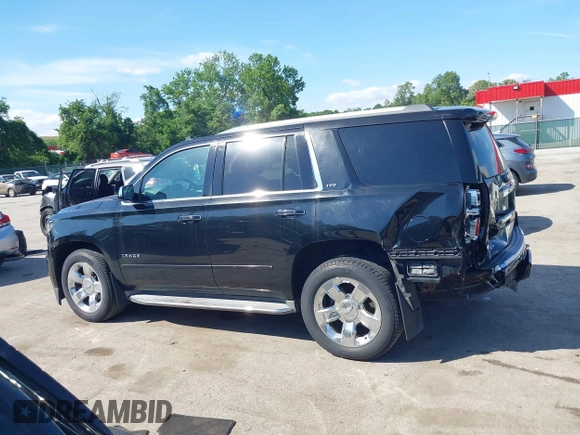 2015 Chevrolet Tahoe LTZ z VIN 1GNSKCKC3FR104845, wystawiony jako IAAI lot #42291785 z przebiegiem 75 047 mil mil oraz . Historia ofert i sprzedaży dostępna na DreamBid. Obrazek 14.