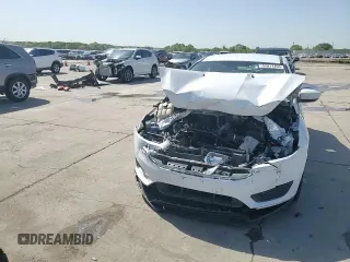 2018 Ford Focus SE z VIN 1FADP3F29JL225126, wystawiony jako Copart lot #52817265 z przebiegiem Nie podano mil oraz Szkoda całkowita • Salvage title. Historia ofert i sprzedaży dostępna na DreamBid. Obrazek 13.
