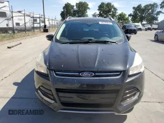 2015 Ford Escape Titanium with VIN 1FMCU0J97FUC80446, listed as a Copart auction lot 58749895 with 106,890 mi miles and Salvage title. Bid and sale history available at DreamBid. Image 5.