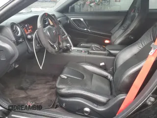 2009 Nissan GT-R Premium z VIN JN1AR54F19M250958, wystawiony jako Copart lot #51364685 z przebiegiem 59 437 mil mil oraz Szkody całkowita. Historia ofert i sprzedaży dostępna na DreamBid. Obrazek 7.