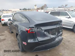 2024 Tesla Model Y with VIN 7SAYGDED8RF116209, listed as a IAAI auction lot 41761804 with 12,048 mi miles and . Bid and sale history available at DreamBid. Image 3.