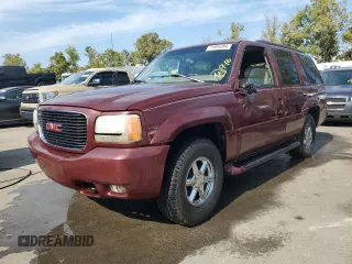1999 GMC Denali with VIN 1GKEK13RXXR910328, listed as a Copart auction lot 71494384 with 251,016 mi miles and Salvage Title. Bid and sale history available at carsss.com. Image 1.