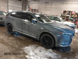 2021 Mazda CX-9 Carbon Edition z VIN JM3TCBDY9M0500803, wystawiony jako IAAI lot #41575201 z przebiegiem 54 626 mil mil oraz . Historia ofert i sprzedaży dostępna na DreamBid. Obrazek 1.
