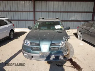 2003 Mitsubishi Outlander XLS z VIN JA4LZ41G53U095457, wystawiony jako IAAI lot #42040732 z przebiegiem 97 236 mil mil oraz . Historia ofert i sprzedaży dostępna na DreamBid. Obrazek 13.