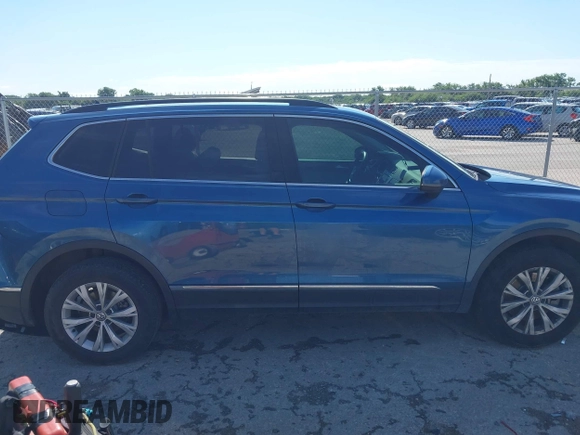 2018 Volkswagen Tiguan SEL z VIN 3VV3B7AX2JM155306, wystawiony jako IAAI lot #42457735 z przebiegiem 48 061 mil mil oraz . Historia ofert i sprzedaży dostępna na DreamBid. Obrazek 13.
