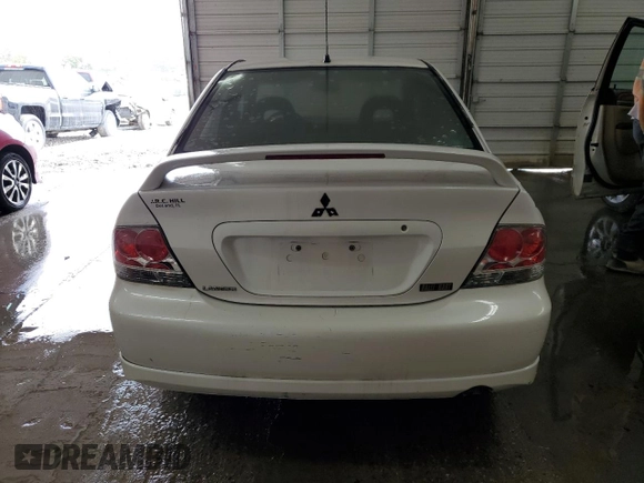 2004 Mitsubishi Lancer with VIN JA3AJ66F64U029144, listed as a Copart auction lot 77437234 with 158,049 mi miles and Salvage Title. Bid and sale history available at DreamBid. Image 6.