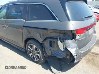 2014 Honda Odyssey Touring with VIN 5FNRL5H90EB082691, listed as a IAAI auction lot 42572977 with 54,413 mi miles and . Bid and sale history available at DreamBid. Image 6.