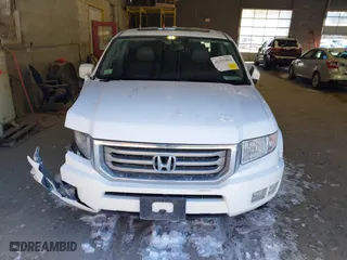 2014 Honda Ridgeline RTL with VIN 5FPYK1F55EB012490, listed as a IAAI auction lot 41391884 with 130,121 mi miles. Bid and sale history available at carsss.com. Image 12.