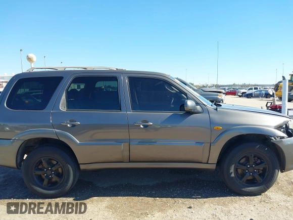 2005 Mazda Tribute S with VIN 4F2CZ06175KM49643, listed as a IAAI auction lot 41397843 with 185,088 mi miles and . Bid and sale history available at carsss.com. Image 13.
