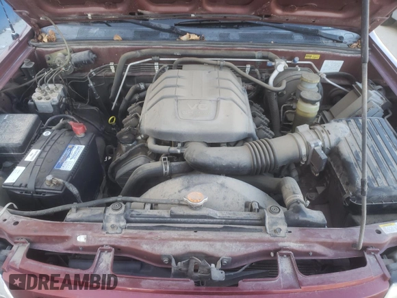 2002 Isuzu Rodeo S with VIN 4S2DM58W824313096, listed as a Copart auction lot 77951364 with 127,470 mi miles and Salvage Title. Bid and sale history available at DreamBid. Image 12.