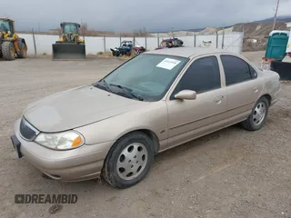 1999 Mercury Mystique GS z VIN 1MEFM6538XK606647, wystawiony jako IAAI lot #41613999 z przebiegiem 90 978 mil mil oraz . Historia ofert i sprzedaży dostępna na DreamBid. Obrazek 2.