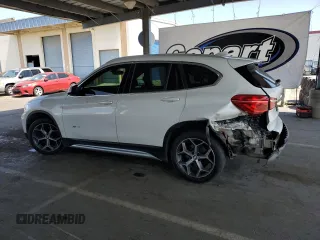 2017 BMW X1 xDrive28i with VIN WBXHT3C35H5F73546, listed as a Copart auction lot 59544545 with 125,185 mi miles and Salvage title. Bid and sale history available at DreamBid. Image 2.