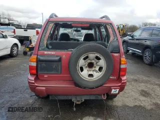 2000 Suzuki Vitara JX z VIN 2S3TD52V9Y6100173, wystawiony jako Copart lot #86200824 z przebiegiem Nie podano mil oraz Szkody całkowita. Historia ofert i sprzedaży dostępna na DreamBid. Obrazek 6.