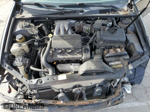 2002 Toyota Camry XLE z VIN 4T1BF32K02U034535, wystawiony jako Copart lot #53894995 z przebiegiem 253 037 mil mil oraz Szkoda całkowita • Salvage title. Historia ofert i sprzedaży dostępna na DreamBid. Obrazek 11.