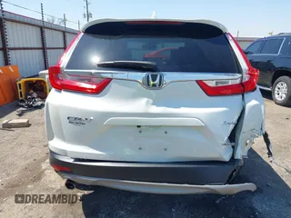 2018 Honda CR-V Touring with VIN 2HKRW2H93JH686298, listed as a IAAI auction lot 41979786 with 100,087 mi miles. Bid and sale history available at carsss.com. Image 16.
