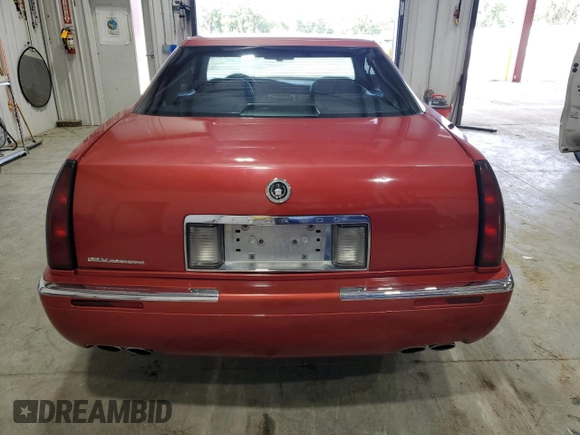1996 Cadillac Eldorado z VIN 1G6EL12Y3TU620055, wystawiony jako Copart lot #72387994 z przebiegiem 128 641 mil mil oraz Czysty tytuł • Clean title. Historia ofert i sprzedaży dostępna na DreamBid. Obrazek 6.