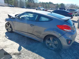 2015 Hyundai Veloster Turbo with VIN KMHTC6AE8FU229198, listed as a IAAI auction lot 41596345 with 74,943 mi miles. Bid and sale history available at carsss.com. Image 3.