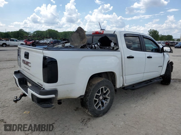 2021 GMC Canyon 4WD AT4 z VIN 1GTG6FEN9M1147406, wystawiony jako Copart lot #55454634 z przebiegiem 82 898 mil mil oraz Szkody całkowita. Historia ofert i sprzedaży dostępna na DreamBid. Obrazek 3.