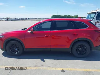 2016 Mazda CX-9 Touring with VIN JM3TCBCY5G0104504, listed as a IAAI auction lot 42314649 with 116,536 mi miles and . Bid and sale history available at DreamBid. Image 14.