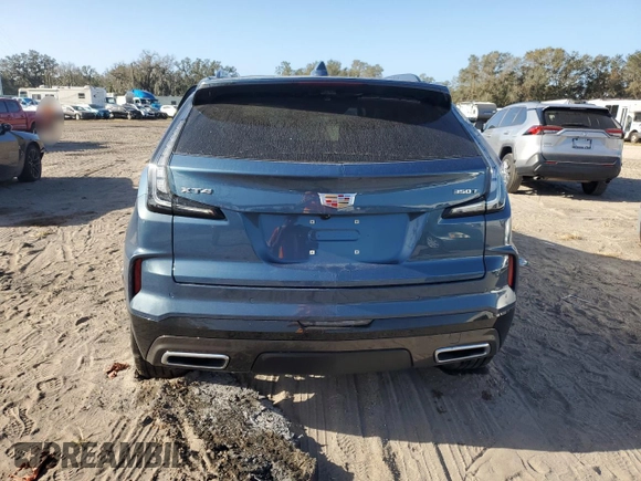 2024 Cadillac XT4 FWD Sport with VIN 1GYFZER40RF249101, listed as a Copart auction lot 76312304 with 1,969 mi miles and Salvage title. Bid and sale history available at DreamBid. Image 6.