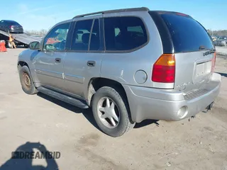 2004 GMC Envoy SLE with VIN 1GKDT13S642213710, listed as a IAAI auction lot 41680656 with 239,187 mi miles. Bid and sale history available at carsss.com. Image 3.