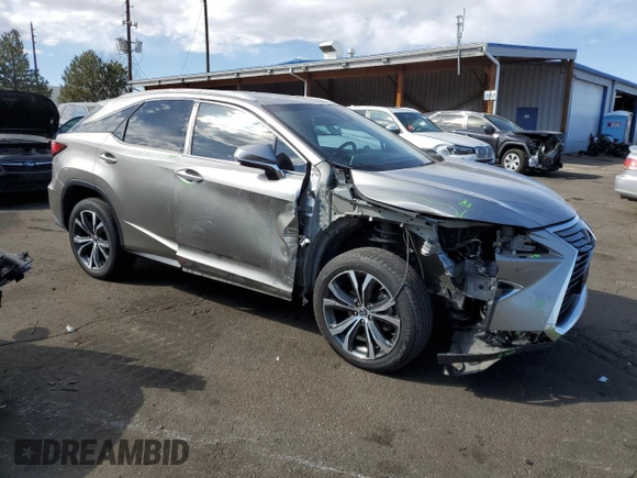 2019 Lexus RX with VIN 2T2BZMCA6KC208074, listed as a Copart auction lot 49067185 with 124,649 mi miles and Salvage Title. Bid and sale history available at carsss.com. Image 4.