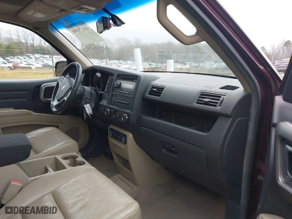 2009 Honda Ridgeline RTL with VIN 5FPYK16559B103698, listed as a IAAI auction lot 41479390 with 144,554 mi miles. Bid and sale history available at carsss.com. Image 5.