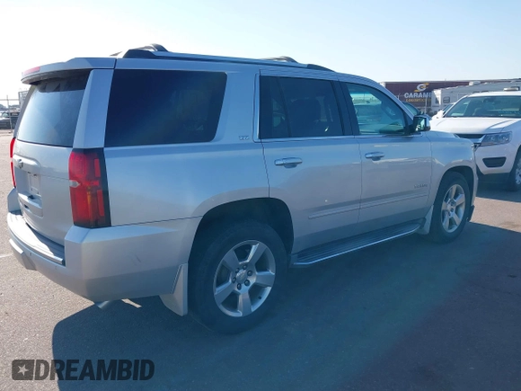 2015 Chevrolet Tahoe LTZ with VIN 1GNSKCKC5FR205739, listed as a IAAI auction lot 40020644 with 142,524 mi miles and . Bid and sale history available at DreamBid. Image 4.