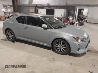 2014 Scion tC with VIN JTKJF5C72E3069294, listed as a IAAI auction lot 41291027 with 171,468 mi miles. Bid and sale history available at carsss.com. Image 1.