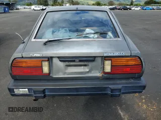 1983 Datsun 280ZX z VIN JN1CZ06S1DX700637, wystawiony jako Copart lot #53893855 z przebiegiem 93 909 mil mil oraz Tytuł czysty. Historia ofert i sprzedaży dostępna na DreamBid. Obrazek 6.
