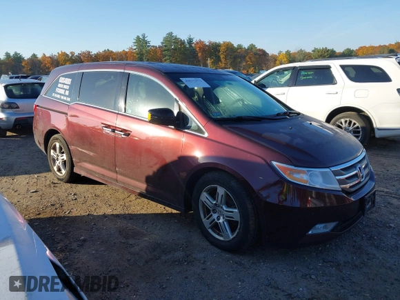2012 Honda Odyssey Touring with VIN 5FNRL5H9XCB067841, listed as a IAAI auction lot 40631672 with 210,237 mi miles and . Bid and sale history available at DreamBid. Image 1.