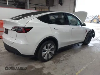 2023 Tesla Model Y Long Range with VIN 7SAYGDEE7PA100523, listed as a IAAI auction lot 40399455 with 18,885 mi miles and . Bid and sale history available at DreamBid. Image 4.