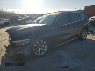 2019 BMW X5 xDrive50i with VIN 5UXJU2C5XKLN49801, listed as a Copart auction lot 86742534 with 0 mi miles and Salvage Title. Bid and sale history available at carsss.com. Image 1.