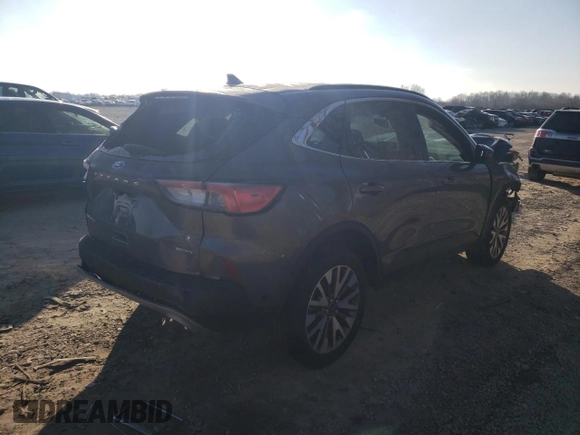 2021 Ford Escape Titanium with VIN 1FMCU9J90MUB16909, listed as a Copart auction lot 42547724 with 24,300 mi miles and Salvage Title. Bid and sale history available at carsss.com. Image 3.