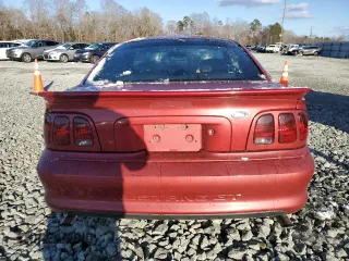 1996 Ford Mustang GT z VIN 1FALP42X0TF168223, wystawiony jako Copart lot #46351085 z przebiegiem 121 657 mil mil oraz Szkoda całkowita • Salvage title. Historia ofert i sprzedaży dostępna na DreamBid. Obrazek 6.
