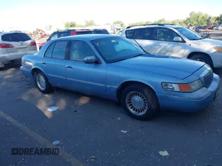 2000 Mercury Grand Marquis LS z VIN 2MEFM75W2YX716477, wystawiony jako IAAI lot #42157322 z przebiegiem 268 096 mil mil oraz . Historia ofert i sprzedaży dostępna na DreamBid. Obrazek 1.