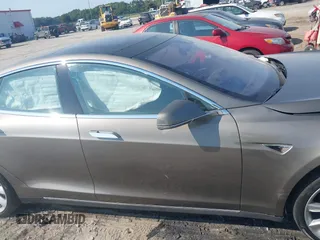2016 Tesla Model S 70 with VIN 5YJSA1E1XGF126620, listed as a IAAI auction lot 40227035 with 71,400 mi miles and . Bid and sale history available at DreamBid. Image 13.