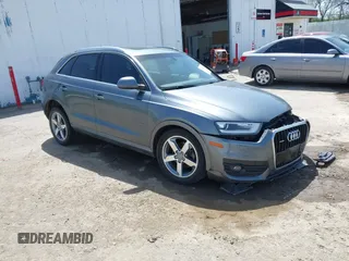 2015 Audi Q3 Premium Plus z VIN WA1EFCFS6FR010285, wystawiony jako IAAI lot #42202068 z przebiegiem 104 945 mil mil oraz . Historia ofert i sprzedaży dostępna na DreamBid. Obrazek 1.