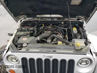 2007 Jeep Wrangler Unlimited Sahara с VIN 1J4GA591X7L158014, выставлен на аукционе Copart как лот 55201105 с пробегом 162 797 миль миль и Списание • Salvage title. История ставок и продаж доступна на DreamBid. Изображение 11.