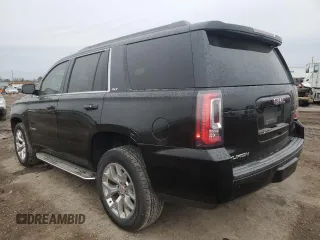 2018 GMC Yukon SLT with VIN 1GKS1BKC6JR389995, listed as a Copart auction lot 86239214 with 164,434 mi miles and Salvage Title. Bid and sale history available at carsss.com. Image 2.