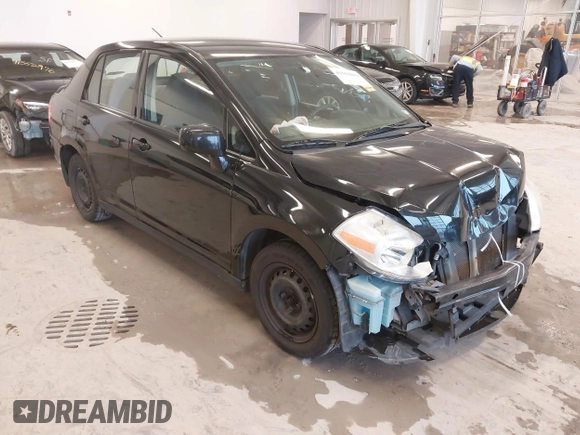 2009 Nissan Versa 1.8 S with VIN 3N1BC11E99L438342, listed as a IAAI auction lot 41561812 with 152,141 mi miles. Bid and sale history available at carsss.com. Image 1.