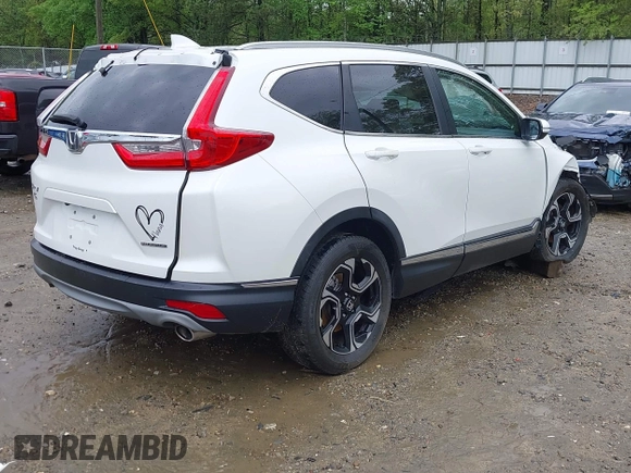 2018 Honda CR-V Touring z VIN 5J6RW1H96JL014087, wystawiony jako IAAI lot #41931640 z przebiegiem Nie podano mil oraz . Historia ofert i sprzedaży dostępna na DreamBid. Obrazek 4.